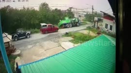 Truck topples over into canal after dodging oncoming car in Thailand