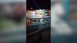 Pet dog patiently watches over a store while his owners are out