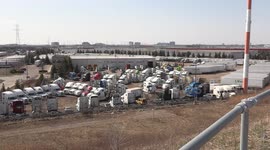 Trucking yard near Toronto full of parked tractor trailers as the economy remains slow in Ontario Canada due to the COVID 19 pandemic lockdown and restrictions on businesses and the supply chain