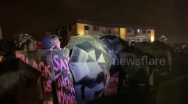 Minnesota protestors throw items, hold guard with umbrellas to protect themselves from police projectiles