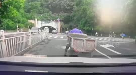 Motorcycle trailer topples backwards hilariously hoisting rider in the air in China