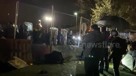 Two protestors strand strong during a police standoff in Brooklyn Center, Minnesota.
