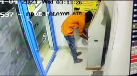 Teenager who tries to hide the ATM s CCTV camera after doing all the crime . He just tried to break it but failed and returned empty handed