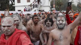 Hundreds of thousands of naked worshippers gather to bathe in Ganges