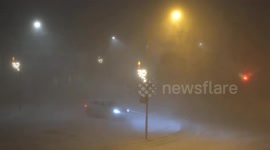 Windy in Iceland. A very snowy and windy day in Husavik in northern Iceland