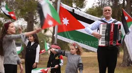 Musician Hassan Awni performed the Jordanian National Anthem with children in celebration of the centenary of the Jordanian state.