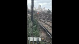 Railway Workers slowly walking to avoid contact with deadly currents in the rail!