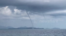Double waterspout forms over Thai island before storm