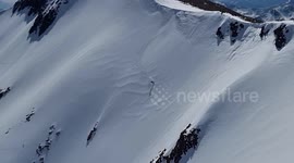 Stunning footage shows daredevil skier jumping off top of mountain beside Ben Nevis before racing down the slopes at 40mph