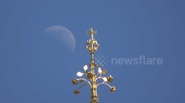 Moon Passes The Houses Of Parliament