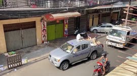 Cambodia police truck patrols streets warning residents to stay inside