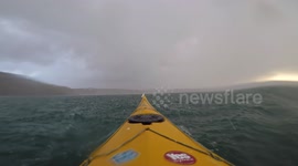 Kayaker caught out in large hailstorm has painful paddle on the water