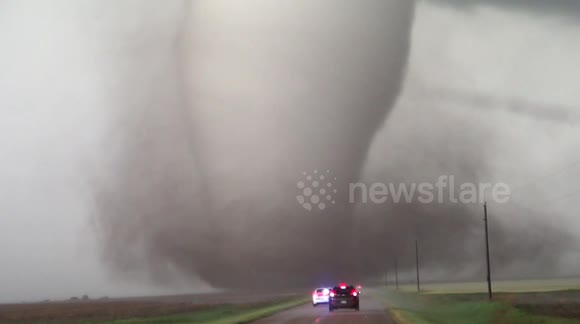Dash cam video of Police in front of a tornado. Violent tornado on the road two hundred meters in front of me. Kansas 2016.