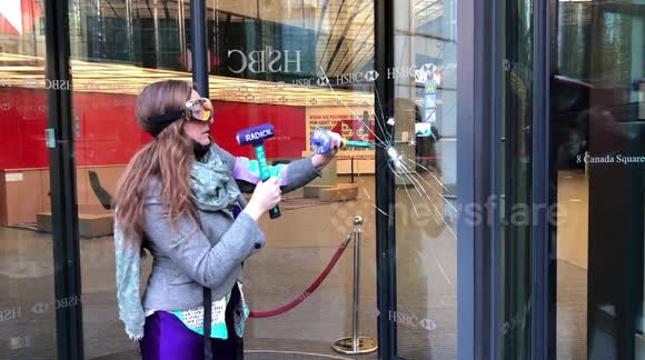 Extinction Rebellion activists smash windows at HSBC headquarters in London