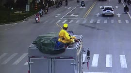 Chinese man in 'Monkey King' costume sits on top of truck to attract tourists for his circus