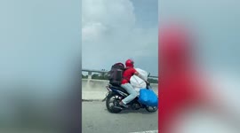Hero delivery rider carries dozens of parcels on motorcycle