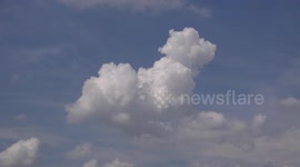 Adventures of Tintin! Video shows amazing cloud that looks just like Tintin's loyal canine companion Snowy bounding through the sky