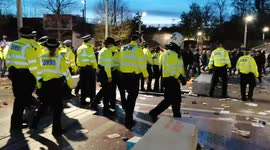 Protestors flee from police as police move forward at Kroenke Out protest at Emirates Stadium
