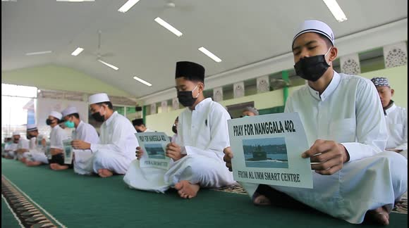 Indonesians pray for 53 crew members of missing submarine