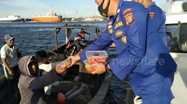 Directorate of the police force of water and air share takjil with dozens of fishermen in a middle of the sea in Medan, Indonesia