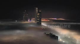 Stunning footage captures some of world's tallest buildings shrouded in thick fog