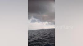 Fishermen terrified by waterspout tornado near their boat