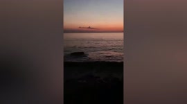 Spooky moment submarine shaped cloud appears off coast of Indonesia