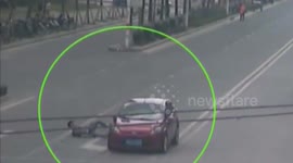 Man feigning injury after car accident in China