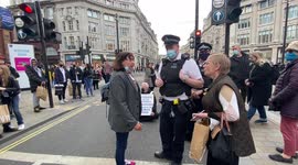 Members of public reacts angrily to Extinction Rebellion activist blocking the road in Oxford Circus