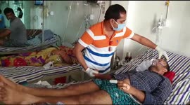 Physician treats COVID-19 patient who struggles to breath in India