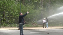 Police use water cannons and tear gas to break up anti-lockdown party in Brussels