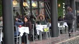 Hardy Brits weather out wind and rain on Bank Holiday Monday in Birmingham, England