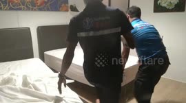 Wild monitor lizard caught napping in luxury hotel room in Thailand