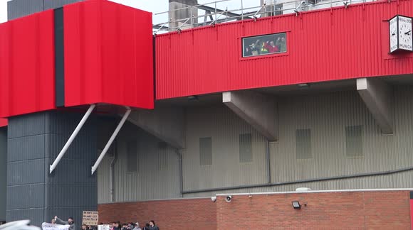 Manchester United Fans Inside Old Trafford Stadium. Banging On The Windows Above The Glazers Out / Anti Glazer Protest / Riot