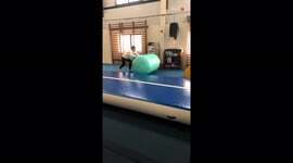 'Fitness Coach Rolls Over Several Yoga Balls '