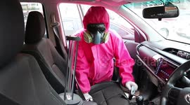 Cleaners in colourful power rangers style hazmat suits battle Covid-19 surge in Thailand