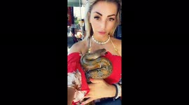 Girl loving her new friend this amazing python