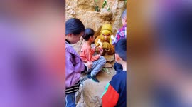 Best job ever? Man dressed up as the 'Monkey King' is fed by excited visitors in China
