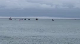 Flotilla of French fishing boats surround Jersey port over rights dispute with UK