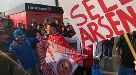 Arsenal fans with anti kroenke signs