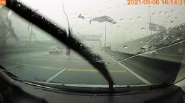 Flying debris knocks over expressway lamppost during Malaysia storm