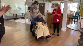 Moment elderly mum celebrates with glass of bubbly after being reunited with daughter for first time in 15 months