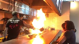 Singaporean restaurant pours bowls of burning fire into their ramen dishes