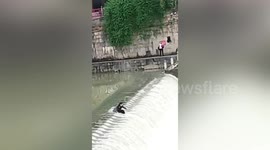 Two girls were swept down by torrents as they take photos in middle of river in China