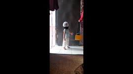 Funny Action Small Children Addicted to Wearing Adult Hats in West Jakarta