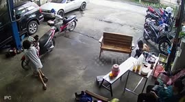 Heart-stopping moment motorcycle falls over onto toddler