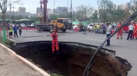 Cyclist dies after falling into deep pit that opened up on road in China