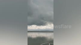 Waterspout tornado lasting five minutes forms off the coast of the Philippines