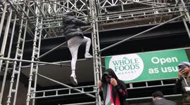 Free Palestine protesters dangerously climb scaffolding on Kensington High Street
