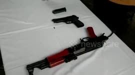 Indian Border Security Force displays weapons dropped by Pakistani drone in northern India